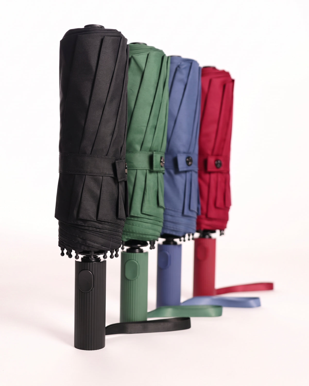 Fünf geschlossene Sapor Taschenschirme in verschiedenen Farben